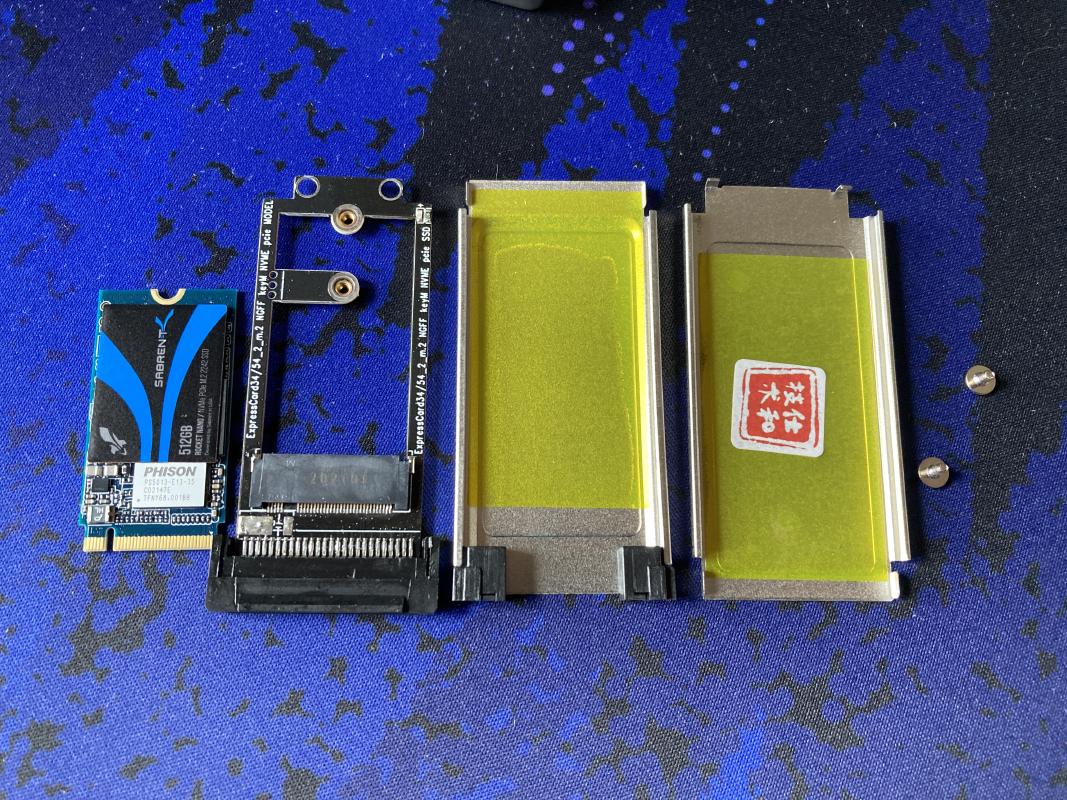 The SSD, adapter PCB, and the case.